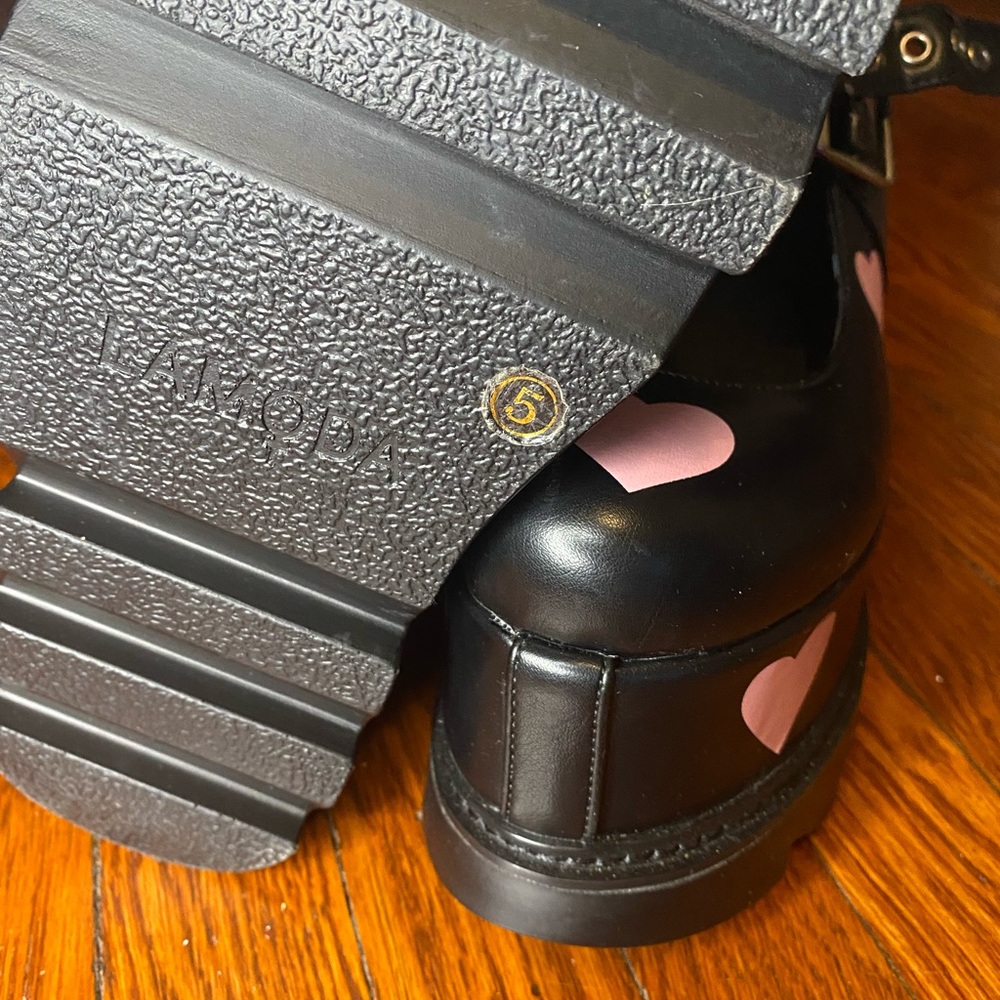 Black Lamoda platform Mary Janes with baby pink hearts.